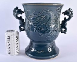 A LARGE CHINESE QING DYNASTY TWIN HANDLED BLUE STONEWARE PORCELAIN VASE decorated in relief with