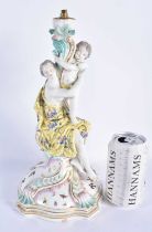 A LARGE 19TH CENTURY GERMAN MEISSEN PORCELAIN FIGURAL CANDLESTICK formed with a female and child. 31
