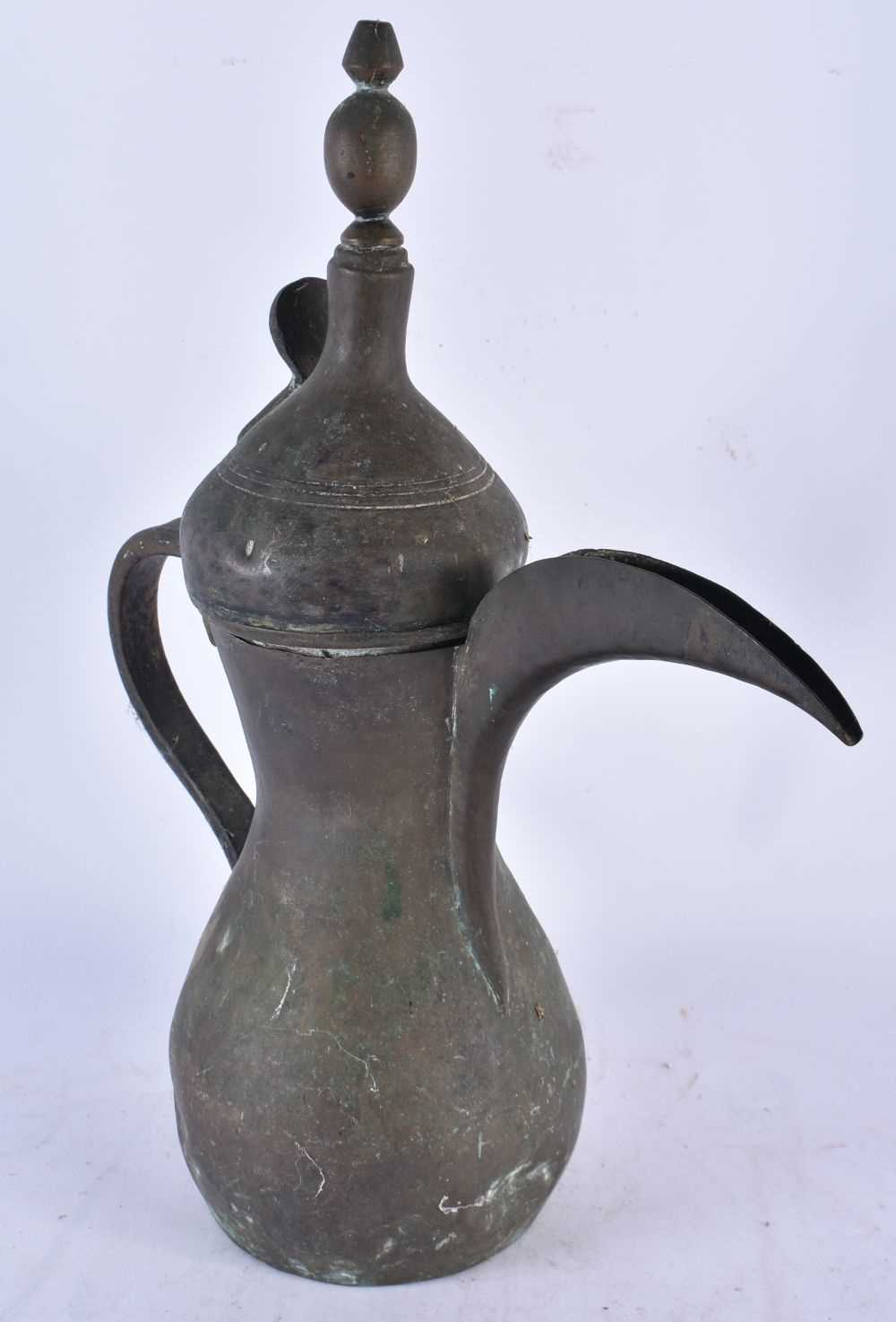 An Antique Arabic Middle Eastern Islamic Bedouin Dallah Coffee Pot.  40cm x 34cm x 14cm - Image 3 of 3