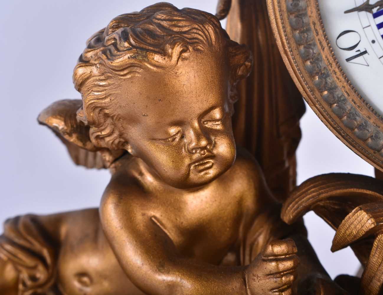 A LARGE 19TH CENTURY FRENCH BRONZE MANTEL CLOCK formed with a central drum encased by two putti. - Image 3 of 7