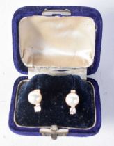 A Cased Pair of Diamond and Pearl Earrings. 1.1cm x 0.7cm, weight 2.1g