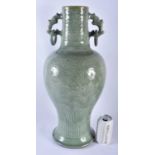 A LARGE 18TH/19TH CENTURY CHINESE TWIN HANDLED CELADON VASE decorated with foliage and vines. 54