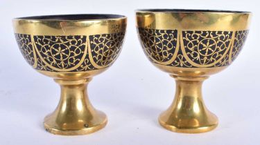 A PAIR OF 19TH CENTURY ANGLO INDIAN BRONZE OVERLAID CARVED COCONUT CUPS decorated with motifs. 8