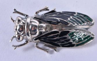 A SILVER AND ENAMEL BUG BROOCH. 13.3 grams. 5 cm x 3 cm.