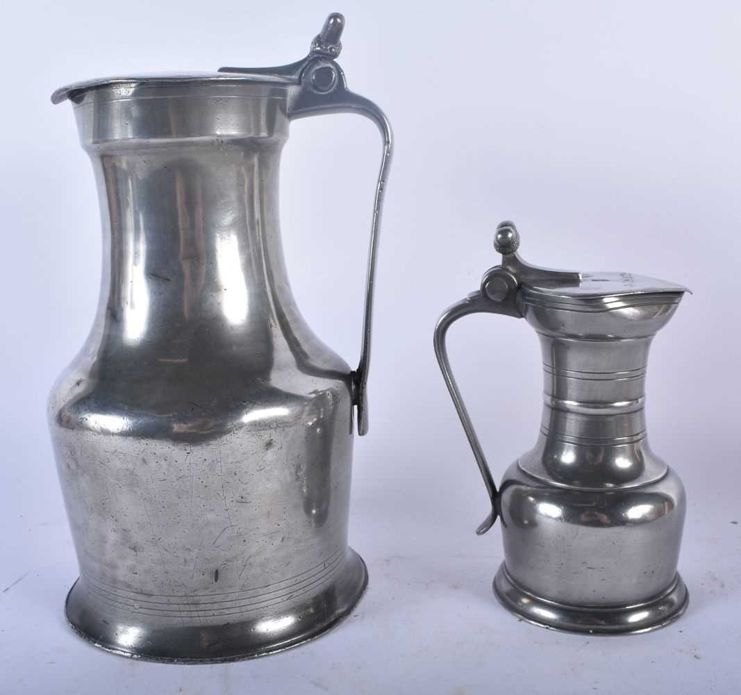 TWO PEWTER FLAGONS together with a bronze desk stand. Largest 30cm x 22 cm. (3) - Image 5 of 9