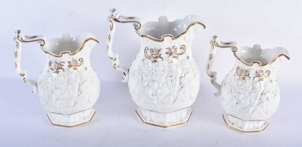 A SET OF THREE 19TH CENTURY SAMUEL ALCOCK POTTERY JUGS decorated with scenes from two engravings