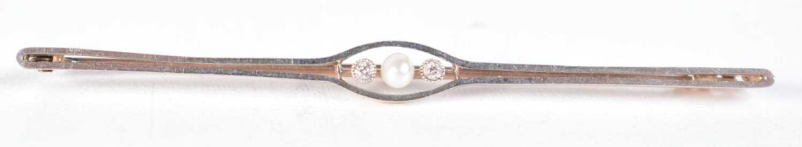 AN EDWARDIAN 15CT GOLD DIAMOND AND PEARL PIN. 3.3 grams. 7 cm wide.