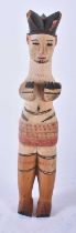 AN UNUSUAL AFRICAN TRIBAL PAINTED WOOD FIGURE modelled with hands covering her breasts. 30cm high.
