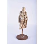 A LARGE COUNTRY HOUSE PLASTER FIGURE OF A BEARDED MALE modelled wearing robes. 40 cm high.