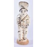 A RARE 17TH CENTURY CHINESE CHIZOU POTTERY FIGURE OF A MALE painted with motifs. 12.5 cm high.