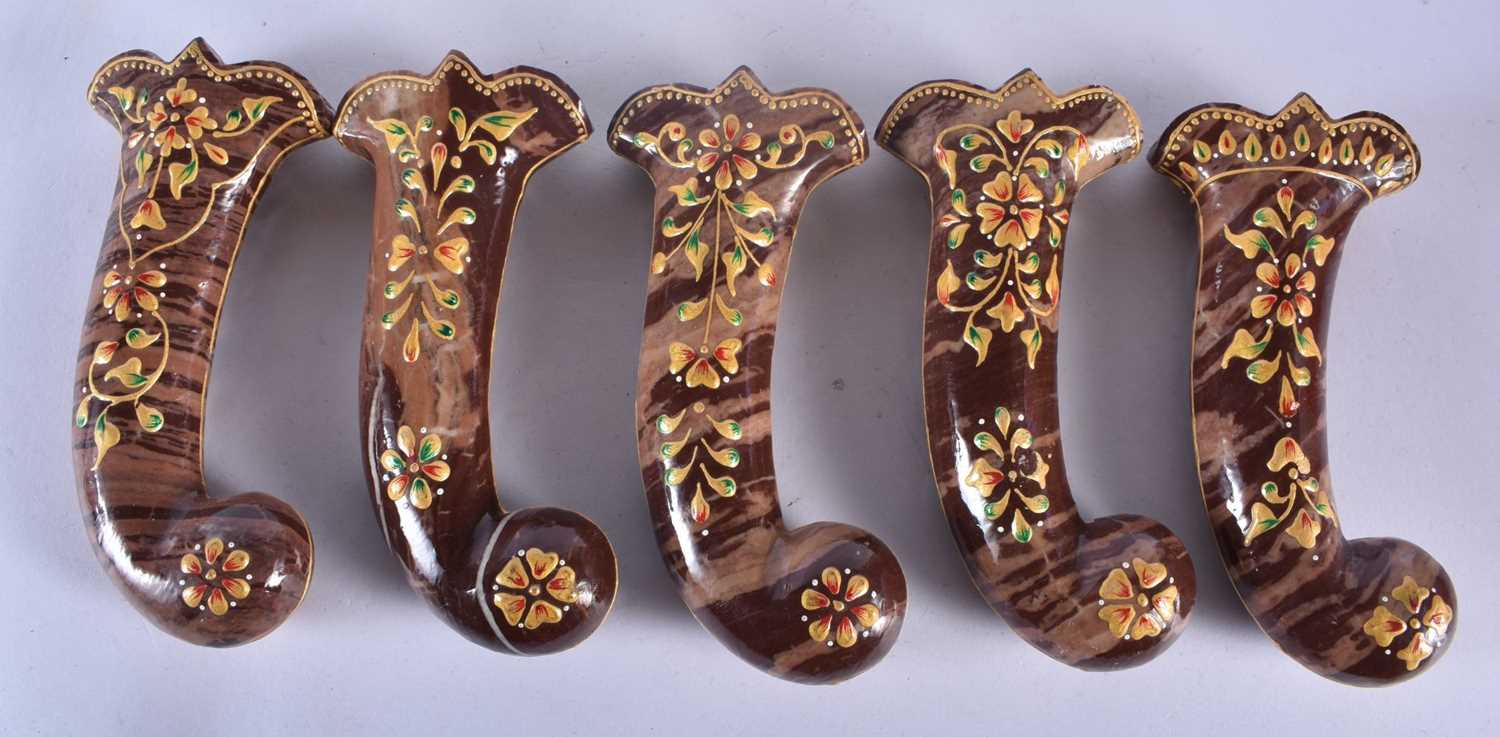 A SET OF FIVE MIDDLE EASTERN QAJAR LACQUER HARDSTONE DAGGER HANDLES overlaid with foliage and vines. - Image 2 of 3