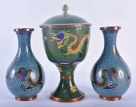 A PAIR OF 19TH CENTURY CHINESE CLOISONNE ENAMEL DRAGON VASES together with a later vase and cover.