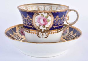 Chamberlain’s Worcester fine breakfast cup and saucer painted with four gilt floral panels on a blue