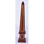 A GEORGE III STYLE MAHOGANY OBELISK. 30cm high.