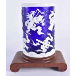 A CHINESE QING DYNASTY BLUE PEKING GLASS BRUSH POT overlaid with precious objects. 11cm x 7 cm.