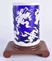 A CHINESE QING DYNASTY BLUE PEKING GLASS BRUSH POT overlaid with precious objects. 11cm x 7 cm.