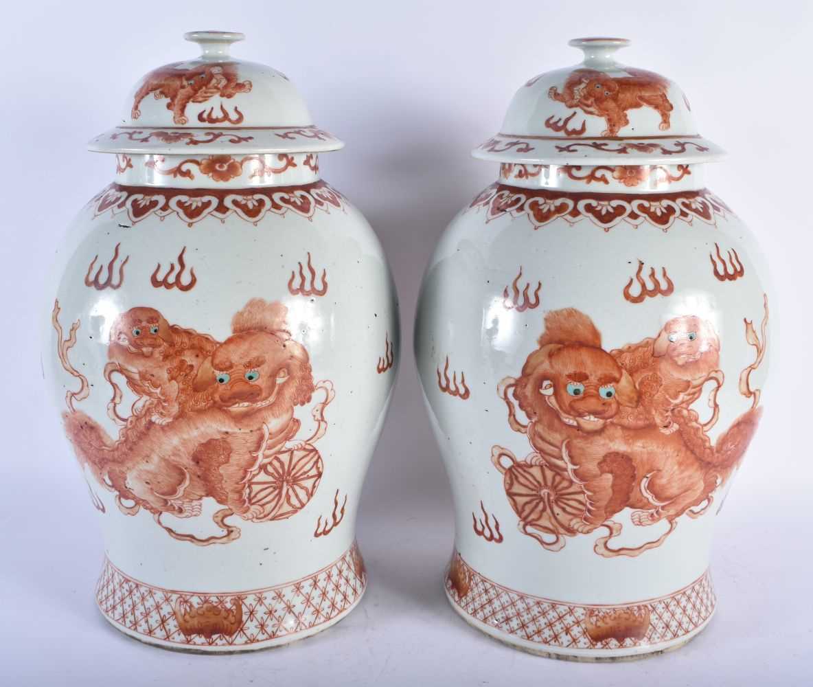 A LARGE PAIR OF CHINESE QING DYNASTY IRON RED PAINTED GINGER JARS AND COVERS painted with buddhistic - Image 2 of 26