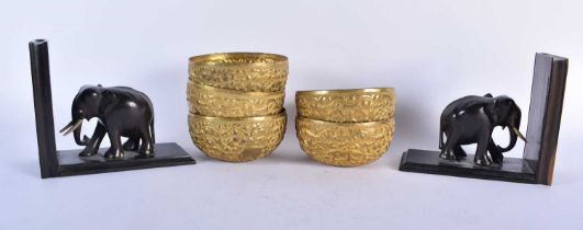 A SET OF FIVE ANTIQUE ASIAN REPOUSSE BOWLS together with a pair of Anglo Indian elephant bookends.