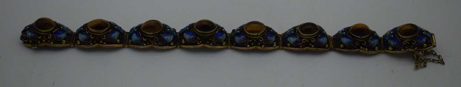 A LATE 19TH CENTURY CHINESE SILVER GILT ENAMEL AND TIGERS EYE BRACELET. 29 grams. 18cm long.