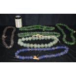 A collection of Central Asian large glass beaded necklaces largest 70 cm. (4).