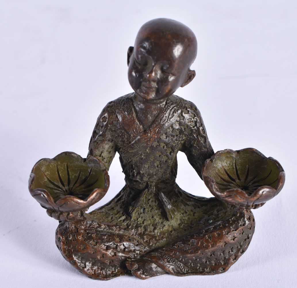 A JAPANESE BRONZE BOY OKIMONO. 135 grams. 6 cm x 5.5 cm.