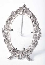 An Ornate Oval Continental Silver Desk Photo Frame. Stamped 800. 9.5 cm x 6.7cm, weight 44.7g (