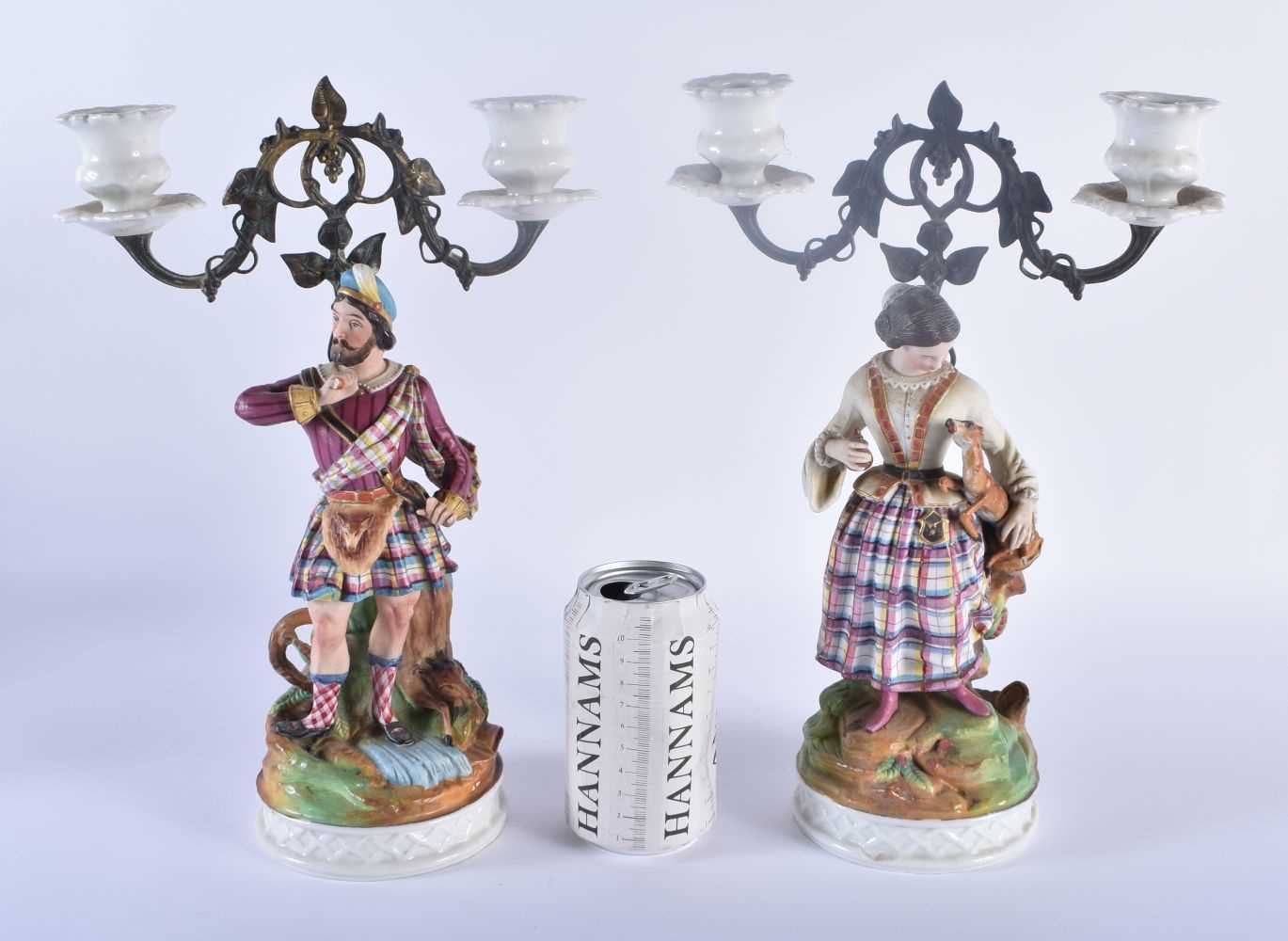 A PAIR OF 19TH CENTURY FRENCH PARIS BISQUE PORCELAIN CANDLESTICKS together with a large 19th century