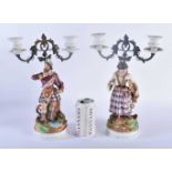 A PAIR OF 19TH CENTURY FRENCH PARIS BISQUE PORCELAIN CANDLESTICKS together with a large 19th century