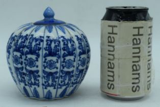 A Chinese porcelain blue and white pumpkin jar with lid 12 cm.