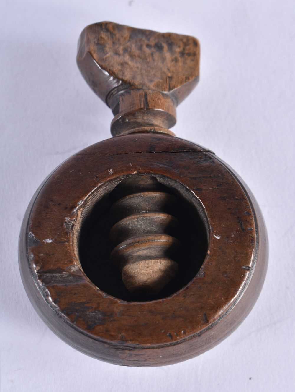 An Antique Treen Thumb Screw Nutcracker. 6.7cm x 4.9cm, weight 23.5g