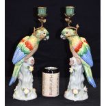 A pair of Ormolu mounted porcelain parrot candlesticks 36 cm (2)