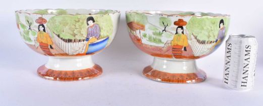 AN UNUSUAL PAIR OF 19TH CENTURY POTTERY ORANGE LUSTRE BOWLS printed and painted with possible