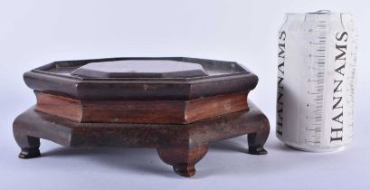 A LARGE 19TH CENTURY CHINESE CARVED WOOD HEXAGONAL STAND Qing, possibly Huanghuali. 19 cm wide.