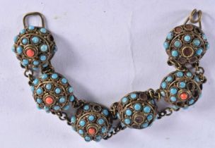An Egyptian Bracelet set with Turquoise and Coral.16.5 cm long, weight 28.1g