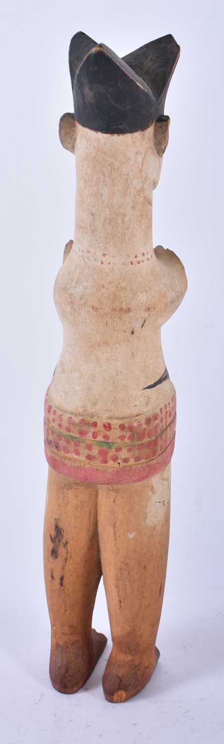 AN UNUSUAL AFRICAN TRIBAL PAINTED WOOD FIGURE modelled with hands covering her breasts. 30cm high. - Image 3 of 4