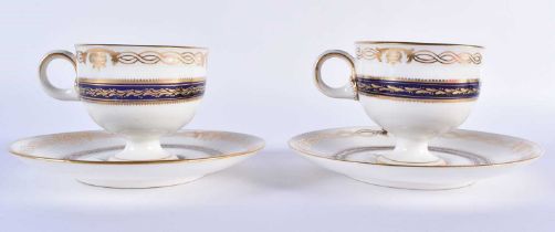 Mid 19th century Royal Worcester pair of rare pedestal cups and saucers painted with flowers in