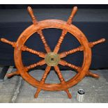 A Contemporary Wooden ship's wheel