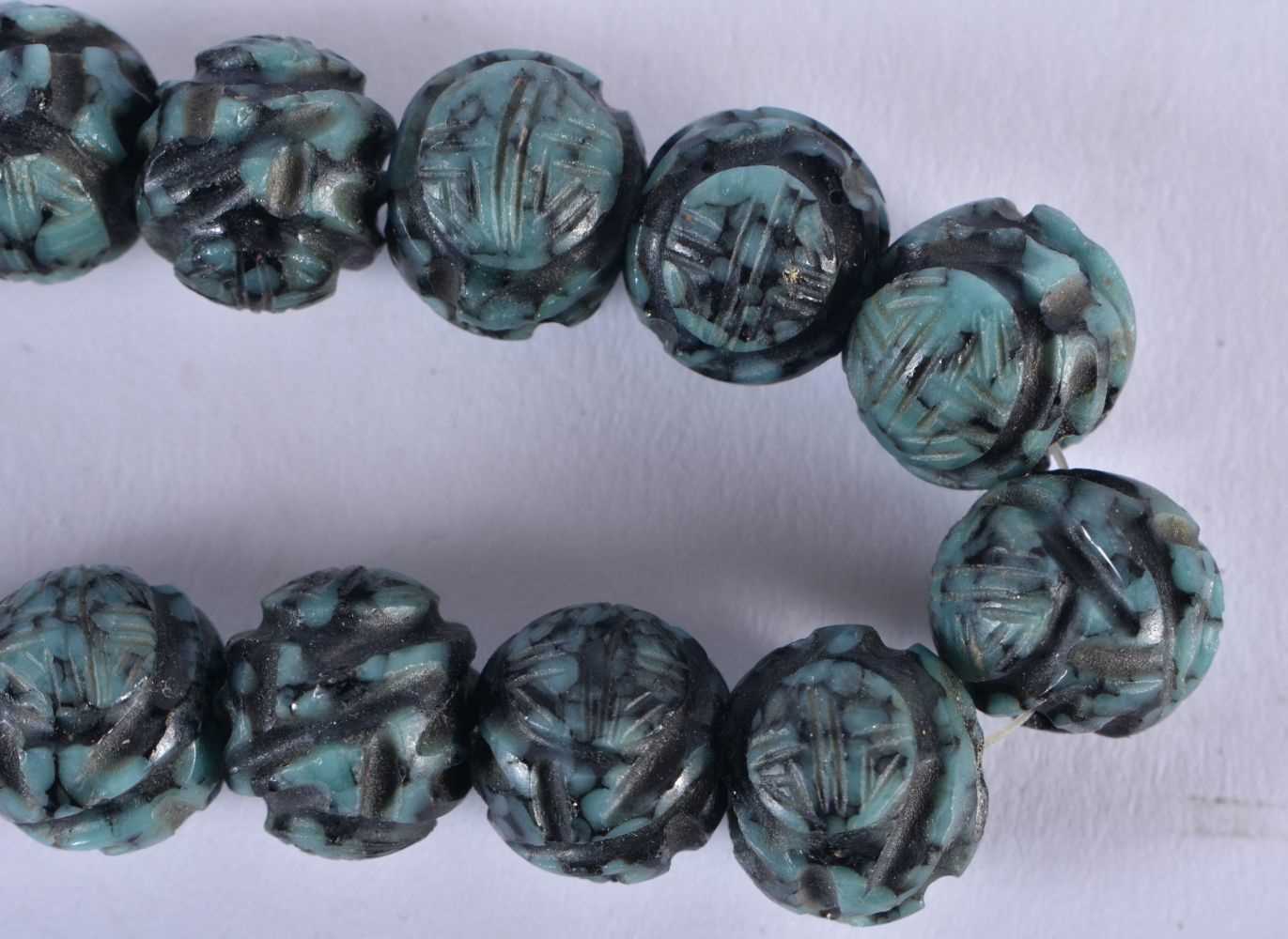 A 19TH CENTURY CHINESE CARVED TURQUOISE NECKLACE Qing. 73 grams. 34 cm long. - Image 3 of 4