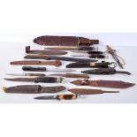 A collection of Vintage knives with wound leather handled grips together with a Bowie Knife ,