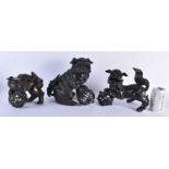 A LARGE 17TH CENTURY CHINESE BRONZE FIGURE OF A BUDDHISTIC LION King, together with two other bronze