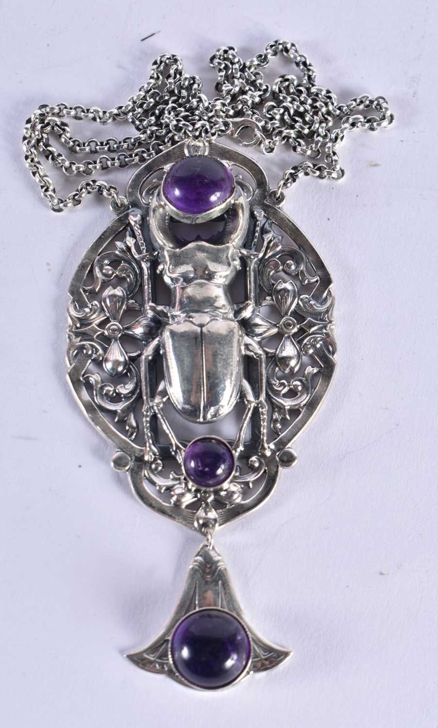 A SILVER SCARAB BEETLE NECKLACE. 49.3 grams. Chain 41 cm long, pendant 6.5 cm x 4.5 cm.