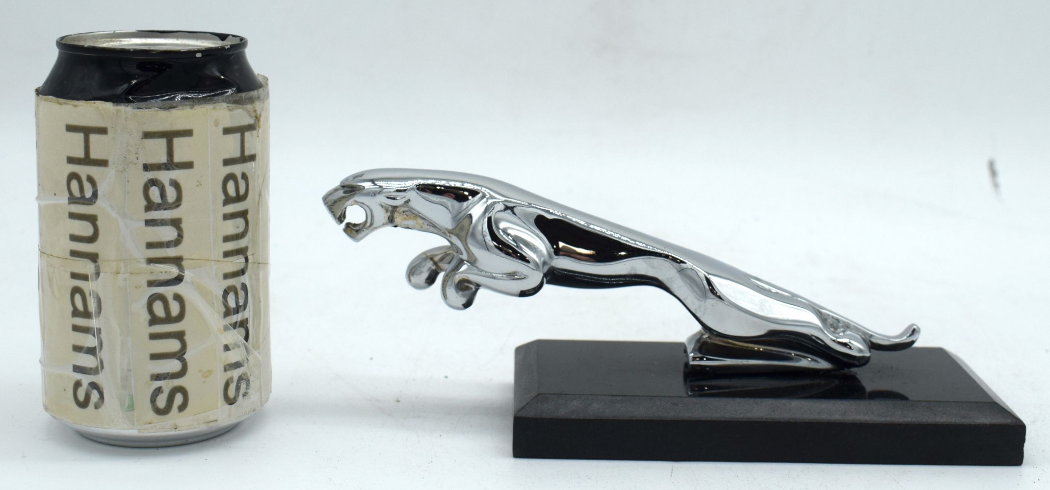 A Chrome Jaguar mascot set on a marble plinth 8 x 20 cm