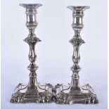 A PAIR OF GEORGE III OLD SHEFFIELD PLATED CANDLESTICKS. 1134 grams. 23 cm x 11cm.