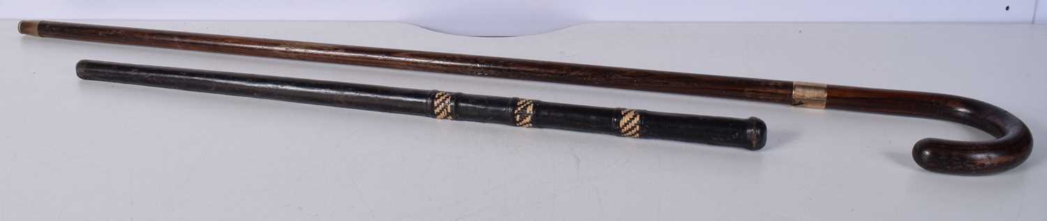 A wooden walking cane with a 9 Ct gold collar stamed 1928 together with another leather encased - Image 2 of 14