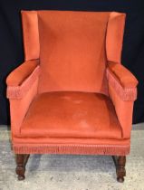 An oak framed upholstered armchair 105 x 77 x 52 cm.