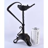 A LOVELY ARTS AND CRAFTS WROUGHT IRON BETTY LAMP of organic form. 30cm x 17 cm.