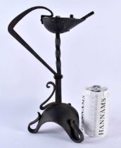 A LOVELY ARTS AND CRAFTS WROUGHT IRON BETTY LAMP of organic form. 30cm x 17 cm.