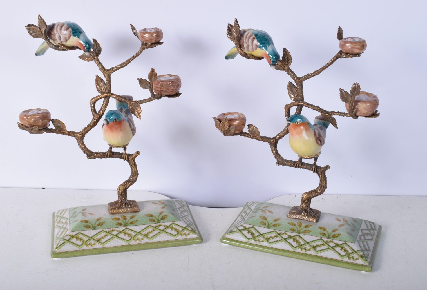 A pair of gilt metal and porcelain birds ornaments 26 x 19 cm (2).