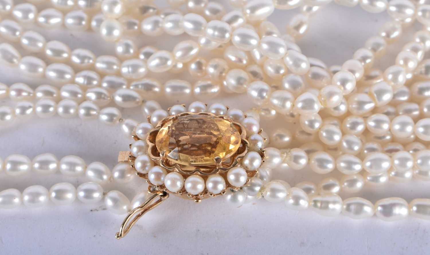 A Six Strand Pearl Necklace with a 14 Carat Gold and Citrine Clasp. 43cm long, weight 58.21g - Image 3 of 4
