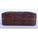A CHINESE QING DYNASTY CARVED CINNABAR LACQUER BOX AND COVER decorated with figures in a